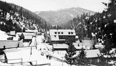 A snow-dusted scene of downtown Bourne in 1921, a view from the front porch of White's mansion