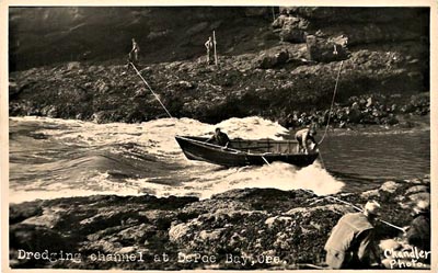Depoe Bay channel being dredged.
